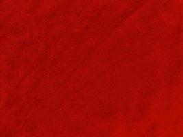 donker rood fluweel kleding stof structuur gebruikt net zo achtergrond. leeg donker rood kleding stof achtergrond van zacht en glad textiel materiaal. Daar is ruimte voor tekst.. foto