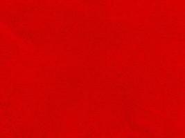 rood schoon wol structuur achtergrond. licht natuurlijk schapen wol. rood naadloos katoen. structuur van pluizig vacht voor ontwerpers Kerstmis dag. detailopname fragment rood wol tapijt.. foto