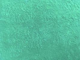 naadloos structuur van oceaan kleur cement muur een ruw oppervlak, met ruimte voor tekst, voor een achtergrond. foto