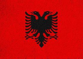 Albanië vlag Aan een getextureerde achtergrond. concept collage. foto