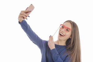 schoonheid grappig tiener- meisje maken selfie met haar mobiele telefoon foto