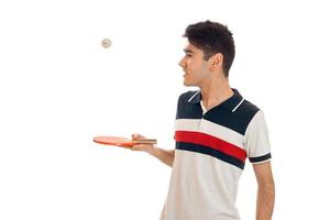 jong vent staat zijwaarts en Holding tennis rackets foto