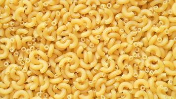 ongekookt elleboog macaroni pasta achtergrond foto