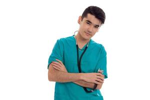 jong knap Mens dokter poseren in blauw uniform geïsoleerd Aan wit achtergrond in studio foto