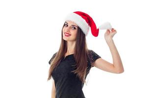 schoonheid brunette meisje in de kerstman hoed foto