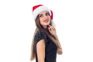 meisje in de kerstman hoed glimlachen foto