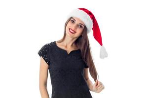 vrolijk meisje in de kerstman hoed foto