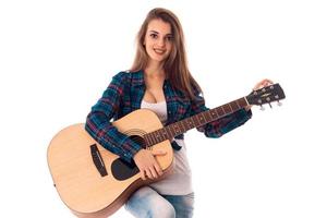 aantrekkingskracht jong vrouw met gitaar foto