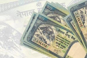 50 nepalese roepies rekeningen leugens in stack Aan achtergrond van groot semi-transparant bankbiljet. abstract presentatie van nationaal valuta foto