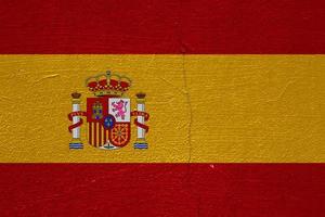 vlag van Spanje Aan een getextureerde achtergrond. conceptuele collage. foto