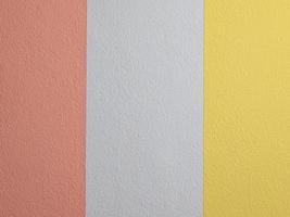 muur met drie kleuren, decoratief gips roze geel wit toon kleuren van cement muur achtergrond structuur verdeeld in drie onderdelen. oppervlakte van beton structuur achtergrond kleuren. foto