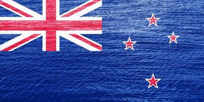 vlag van nieuw Zeeland Aan een getextureerde achtergrond. concept collage. foto