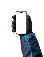 telefoon mockup in Mens hand- met handschoen. geïsoleerd Scherm voor ski app Promotie foto