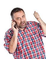 middelbare leeftijd Mens spreekt Aan een mobiel telefoon foto