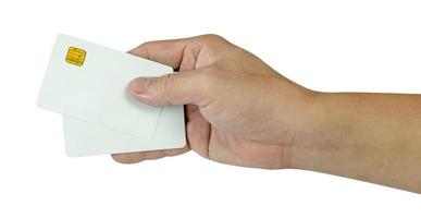 hand- Holding twee blanco wit credit kaart geïsoleerd Aan wit achtergrond, kunststof pinpas, inclusief knipsel pad foto