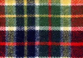 rood groen blauw en geel Schotse ruit kleding stof structuur achtergrond foto