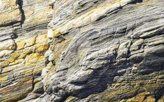 mooi rots klif steen kei structuur patroon strand in Mexico. foto