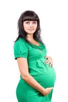 portret van een zwanger jong vrouw foto