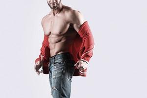 gespierd Mens bodybuilder vervelend jeans foto