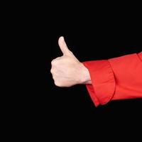 hand- in rood uniform shows een gebaar van goedkeuring foto