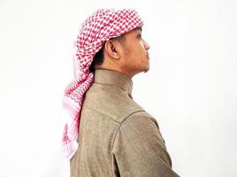 een moslim man met een gewaad en een tulband foto