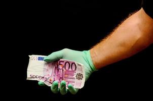 hand- Holding contant geld Bill foto