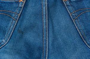 jeans structuur met zak, spijkerbroek denim structuur en achtergrond, spijkerbroek van terug foto