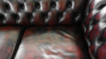 oprecht leer bekleding achtergrond voor een luxe decoratie in rood bruin tonen, diep bruin leer luxe sofa achtergrond foto