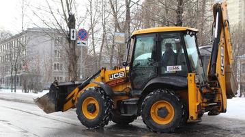 Sankt petersburg Rusland - 02 17 2023 graafmachine gebouw een weg in een plaats bouw foto