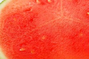 structuur van sappig pulp van rood pitloos watermeloen detailopname, vol scherm net zo achtergrond foto