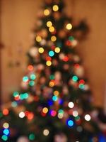 Kerstmis boom lichten vervagen achtergrond foto