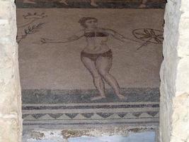 bikini bad meisjes Bij oude Romeins mozaïek- van villa del casa, Sicilië foto