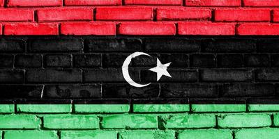 vlag van Libië Aan een getextureerde achtergrond. concept collage. foto