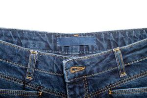 kleding stof label voor kleren Aan blauw denim broek foto