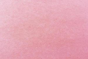 close-up shot van licht roze papier structuurpatroon voor achtergrond foto