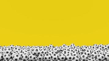 stapel van voetbal ballen Aan geel achtergrond foto