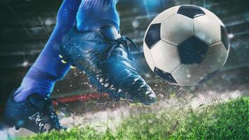 Amerikaans voetbal tafereel Bij nacht bij elkaar passen met dichtbij omhoog van een voetbal schoen raken de bal met macht foto