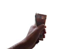hand- houdt sommige geld bankbiljetten, concept van economisch rijkdom en succes foto
