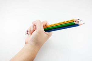 kleurrijk potlood in vuist macht van geschreven woord Aan wit achtergrond foto