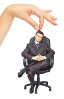 zakenman zittend Aan stoel en vrouw hand- foto