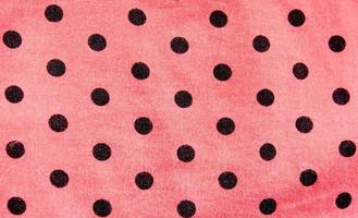 roze en zwarte polka dot achtergrond foto