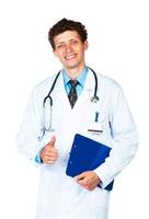jong dokter Holding een kladblok en vinger omhoog Aan wit achtergrond foto