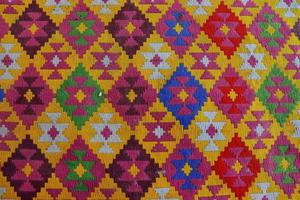 helder plein regeling van gekleurde kruis steek, tapijt textuur.behang ,achtergrond foto