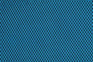 synthetisch kleding stof textuur, blauw plaid, mooi achtergrond patroon. fragment van thermisch ondergoed kleding stof. foto