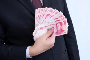 Holding yuan of rmb, Chinese valuta foto