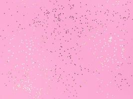 confetti sterren sprankelend op een roze achtergrond foto