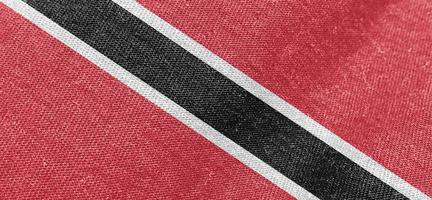 Trinidad en Tobago kleding stof vlag katoen materiaal breed behang gekleurde kleding stof Trinidad en Tobago vlaggen achtergrond foto