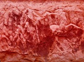 close-up van rode steen of rotswand voor achtergrond of textuur