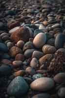 kiezelsteen stenen Aan de strand - zacht focus met wijnoogst filter foto