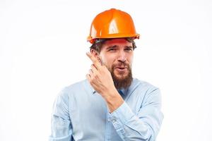 Mens in bouw uniform oranje verf industrie professioneel bijgesneden visie foto